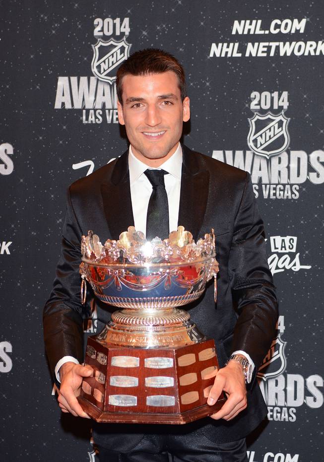 Patrice Bergeron of the Boston Bruins with the Frank J. Selke Trophy at the 2014 NHL Awards in Encore Theater on Tuesday, June 24, 2014, at Wynn Las Vegas.