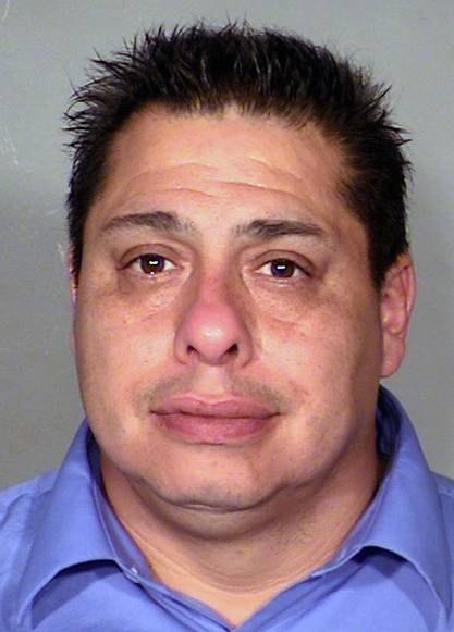 This Thursday, Jan. 16, 2014, booking photo provided by Las Vegas Metropolitan Police Department of Carlos Enrique Barron of North Las Vegas, Nev. Barron, 43, was sentenced Tuesday, June 24, 2014, to 90 days in jail and five years' probation for an April 2011 shooting involving a crew of the reality TV show "Repo Games" in his North Las Vegas neighborhood.
