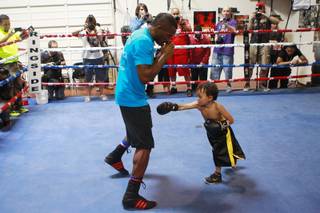 WBA junior middleweight champion Erislandy Lara pretends to spar with Prince Duarte during a media workout Wednesday, June 25, 2014.