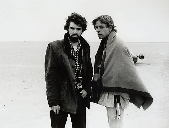 In this March 1976 publicity photo, director George Lucas and actor Mark Hamill, who portrays Luke Skywalker, are shown on the salt flats of Tunisia during principal photography of the original "Star Wars." 