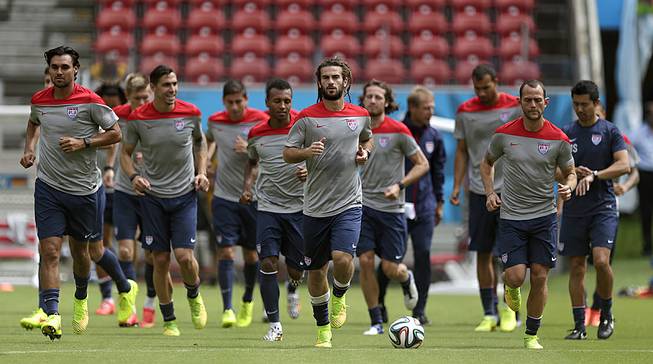 U.S. soccer players congregate on the pitch during a training session Wednesday, June 25, 2014, in Recife, Brazil. The United States will play Belgium in the 2014 World Cup on July 1.