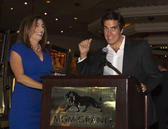 Magician David Copperfield and Jean Venneman with Bally share a laugh before the unveiling of his new slot machine at the MGM Grand on Thursday, June 26, 2014.