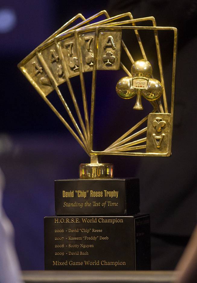 The David "Chip" Reese Trophy sits on the WSOP Poker Players Championship final's table of professional poker players as players face off for the prestigious $50,000 buy-in at the Rio on Thursday, June 26, 2014.