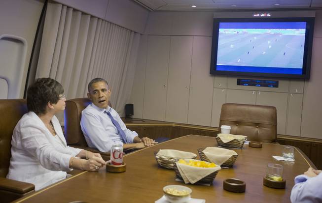 President Barack Obama and White House Senior Adviser Valerie Jarrett watch the World Cup soccer match between US and Germany in the conference room aboard Air Force One en route to Minnesota, Thursday, June 26, 2014. 