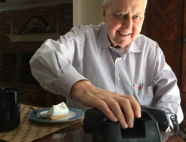 Bob Farquhar, a retired NASA engineer, hangs up from a conference call with his team on June 2, 2014. The group hopes to take control of a retired satellite.