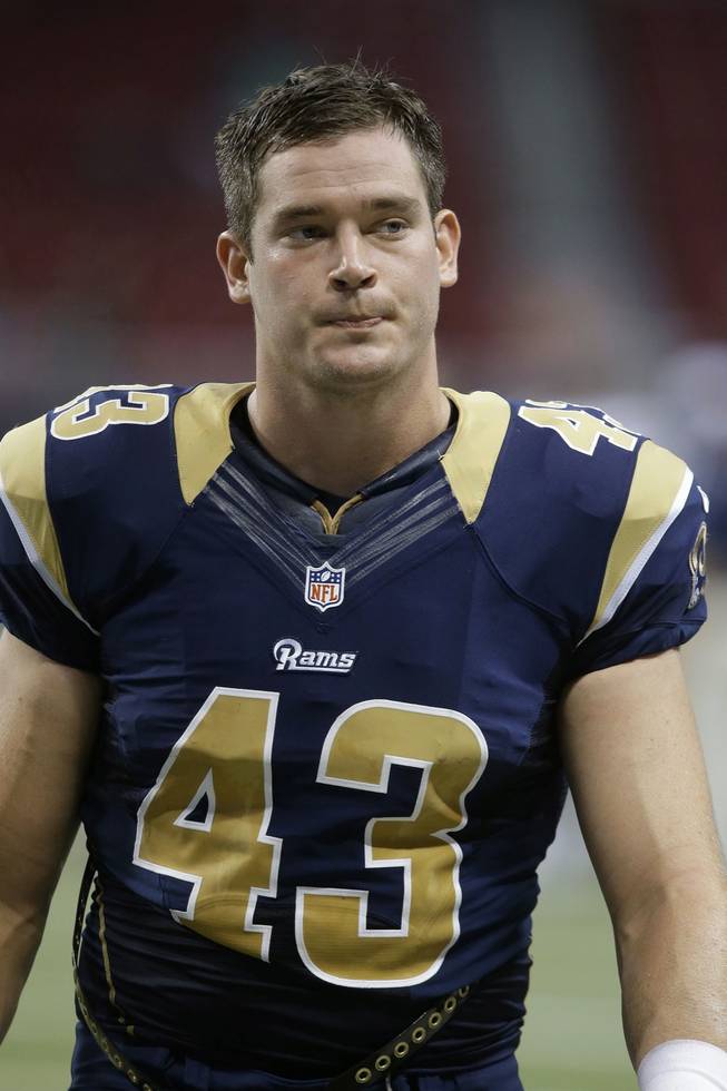 This Aug. 17, 2013, file photo shows St. Louis Rams tight end Philip Lutzenkirchen (43) walking off the field during the fourth quarter of an NFL football game in St. Louis. Georgia state police say the former Auburn University tight end has died in a one-car crash in western Georgia early Sunday, June 29, 2014.
