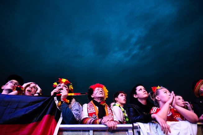 Fans watch the Brazil World Cup round of 16 soccer match between Germany and Algeria at a public viewing event in Berlin, Monday, June 30, 2014. Germany plays Algeria at the Estadio Beira-Rio stadium in Porto Alegre, Brazil, Monday. 