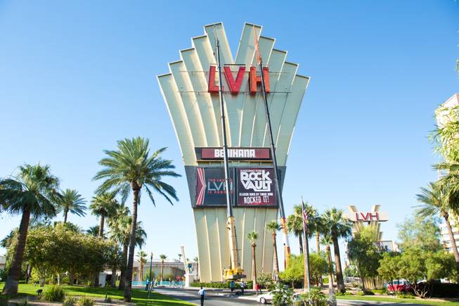 Yesco sets up large cranes in preparation to remove the LVH letters off the main sign of Westgate's newly purchased property, formerly the Las Vegas Hotel, Tuesday July 1, 2014.