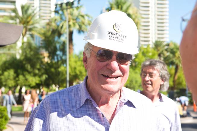 David Siegel, Founder and CEO of Westgate Resorts, smiles after being hoisted up over 200 feet to remove the LVH letters off the main sign of Westgate's newly purchased property, Tuesday July 1, 2014.