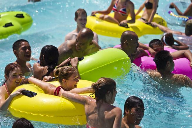 Attendees enjoy the Surf-A-Rama Wave Pool during opening day at Cowabunga Bay, the new water park in Henderson with over 25 rides & attractions on Friday, July 4, 2014.  L.E. Baskow