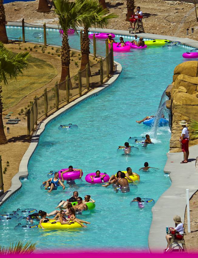 Attendees float along the Cowabunga River during opening day at Cowabunga Bay, the new water park in Henderson with over 25 rides & attractions on Friday, July 4, 2014.  L.E. Baskow