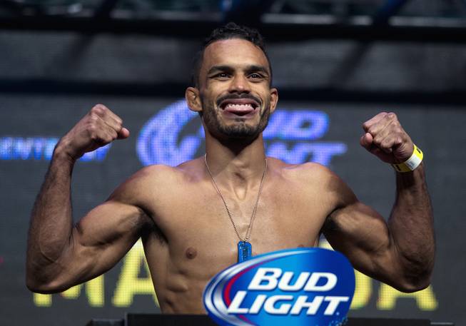 Bantamweight Rob Font flexes with tongue out during the UFC 175 weigh ins at the Mandalay Bay Resort on Friday, July 4, 2014.