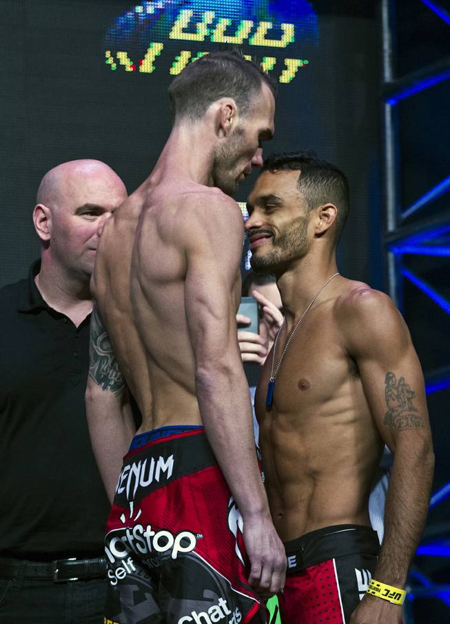 Bantamweight George Roop looks way down on opponent Rob Font during the UFC 175 weigh ins at the Mandalay Bay Resort on Friday, July 4, 2014.