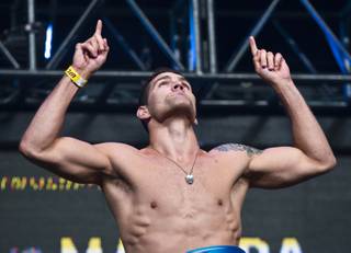 World Middleweight Champion Chris Weidman points to the heavens during the UFC 175 weigh ins at the Mandalay Bay Resort on Friday, July 4, 2014.