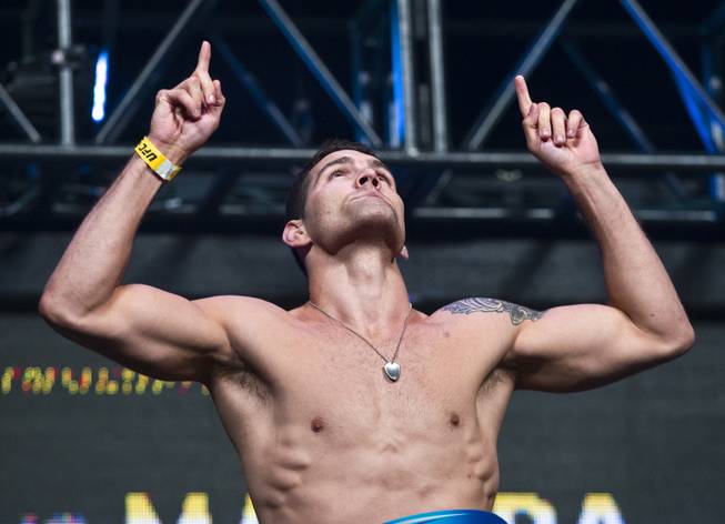 World Middleweight Champion Chris Weidman points to the heavens during the UFC 175 weigh ins at the Mandalay Bay Resort on Friday, July 4, 2014.