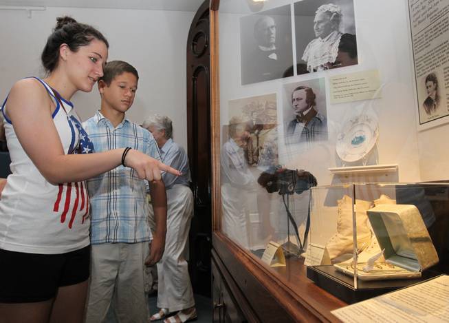 Lexie Yut 17, and Nico Yut 14 of Dallas look at the Ida McKinley tiara on public display at the William McKinley Presidential Library and Museum on Wednesday, July 2, 2014 in Canton, Ohio.