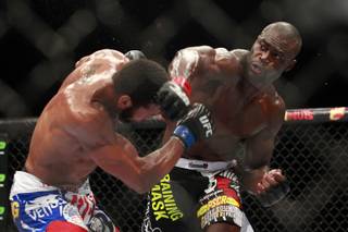 Uriah Hall hits Thiago Santos with a right during their fight at UFC 175 at the Mandalay Bay Events Center Saturday, July 5, 2014. Hall won by decision.