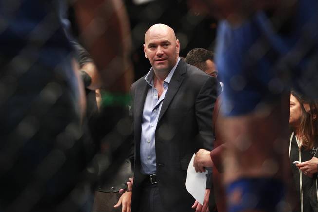 Dana White is seen in the octagon after Ronda Rousey's TKO of Alexis Davis at UFC 175 at the Mandalay Bay Events Center Saturday, July 5, 2014. Rousey retained her title with a 16-second TKO.