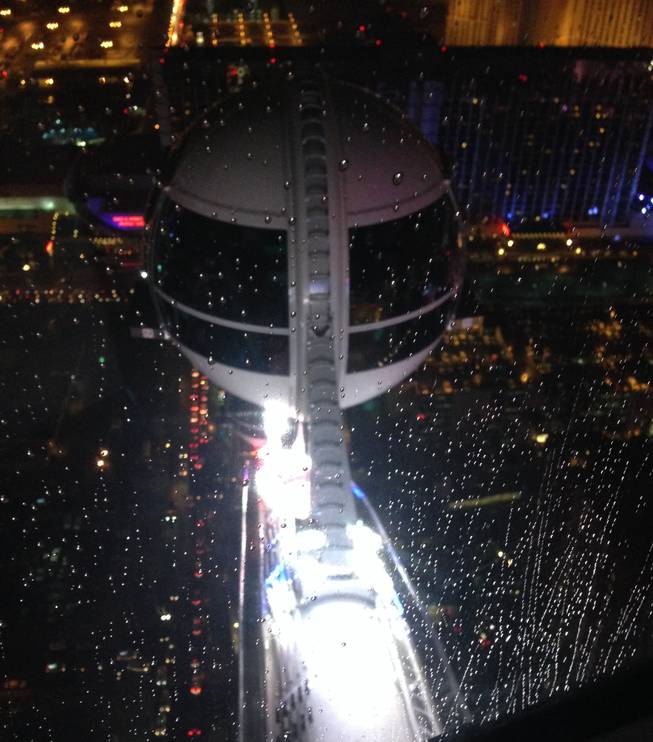 Rain falls on the High Roller on Friday, July 4, 2014.