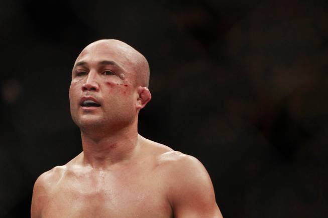 With a welt developing under his eye, B.J. Penn heads to his corner between rounds of his fight against Frankie Edgar at "The Ultimate Fighter" 19 finale Sunday, July 6, 2014 at the Mandalay Bay Events Center.