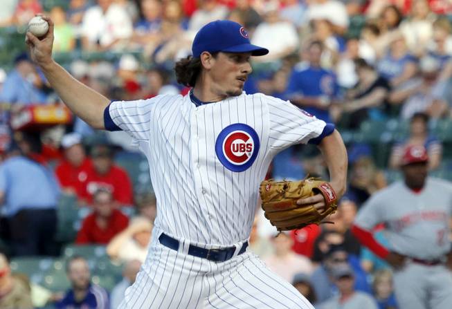 Chicago Cubs starting pitcher Jeff Samardzija delivers during the first inning of a baseball game against the Cincinnati Reds in Chicago. The Oakland Athletics have an agreement in place to acquire right-handers Jeff Samardzija and Jason Hammel from the Cubs for three top-line prospects in a surprising trade for baseball's top team.