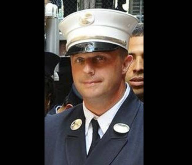 This photo taken on June 26, 2014, and released by the NYFD, shows Lt. Gordon Ambelas, who died at a hospital late Saturday night, July 5, 2014, after battling a blaze that broke out on an upper floor of a Brooklyn public-housing high-rise in New York. Two other firefighters were taken to Bellevue Hospital with minor injuries, and two civilians were treated for minor injuries at area hospitals.