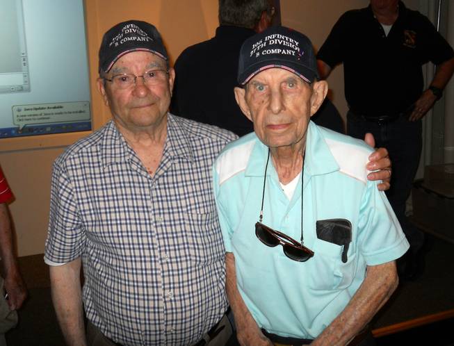 World War II veterans Wilfred "Spike" Mailloux, left, and John Sidur, both of Cohoes, N.Y., pose at a presentation on the 70th anniversary of the Battle of Saipan at the New York State Military Museum on June 7, 2014, in Saratoga Springs, N.Y. Both served on Saipan with the U.S. Army’s 27th Infantry Division, 105th Infantry Regiment. The Army’s 27th Infantry Division bore the brunt of Japan’s largest mass suicide attack, launched before dawn on July 7, 1944, on the island of Saipan. The division’s 105th Regiment saw more than 400 killed and 500 wounded during the attack by more than 3,000 Japanese soldiers and sailors. The 27th was a former New York National Guard unit that still had many New Yorkers among its ranks when it landed on Saipan after the U.S. Marines made the initial beach assault on June 15, 1944.