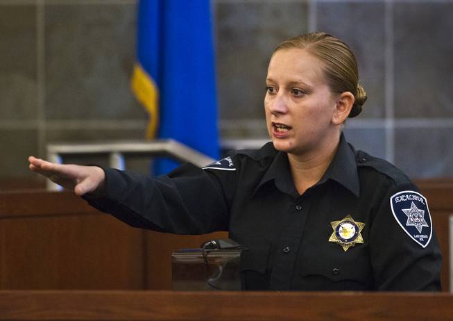 Excalibur security officer Kaylynn Kalmback points out suspect Joey Kadmiri,in the courtroom as his trial begins Tuesday, July 8, 2014.  He was allegedly beat up by the Thunder From Down Under Male Revue dancers after trying to burglarize their locker room.
