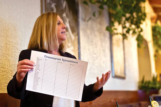 At a monthly Toastmasters meeting, Mensa member Lauren Sheer explains her duties as grammarian, which involve noting grammatical errors fellow members make during their speeches.