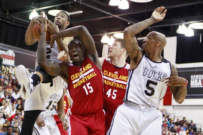 From left, Milwaukee forward Jabari Parker, Cleveland forward Anthony Bennett, Cleveland forward Jack Cooley and Milwaukee guard Gilbert Brown contest a rebound during their NBA Summer League game Friday, July 11, 2014 at the Cox Pavilion.