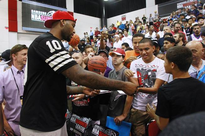 Sacramento center DeMarcus Cousins signs autographs after Cleveland's NBA Summer League game against the Milwaukee Bucks Friday, July 11, 2014 at the Cox Pavilion.