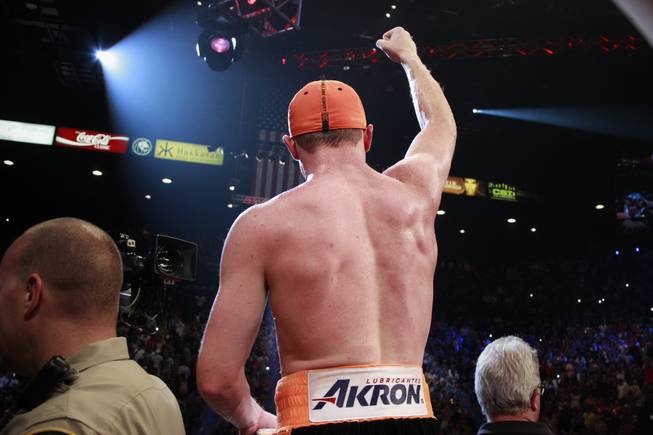 Saul "Canelo" Alvarez salutes the crowd after his 12 round split decision win over Erislandy Lara in their super welterweight fight Saturday, July 12, 2014 at the MGM Grand Garden Arena.