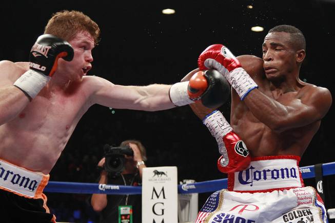 Saul "Canelo" Alvarez throws a left at Erislandy Lara during their super welterweight fight Saturday, July 12, 2014 at the MGM Grand Garden Arena. Canelo won a split decision.