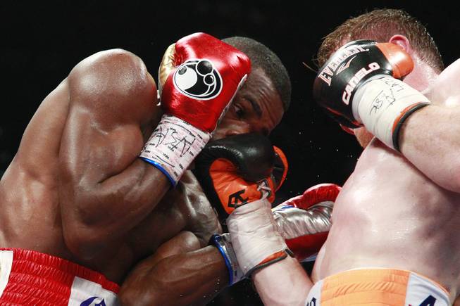 Saul "Canelo" Alvarez tags Erislandy Lara with a right during their super welterweight fight Saturday, July 12, 2014 at the MGM Grand Garden Arena. Canelo won a split decision.