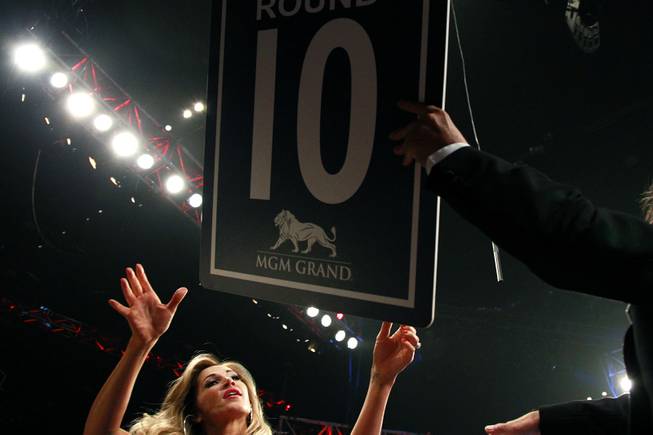 A ring girls takes the "Round 10" sign during the Saul "Canelo" Alvarez vs. Erislandy Lara super welterweight fight Saturday, July 12, 2014 at the MGM Grand Garden Arena. Canelo won a split decision.