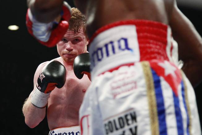 Saul "Canelo" Alvarez chases down Erislandy Lara during their super welterweight fight Saturday, July 12, 2014, at the MGM Grand Garden Arena. Canelo won a split decision.