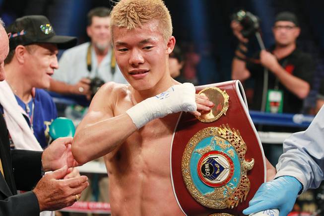Tomoki Kameda puts his belt on his shoulder after knocking out Pungluang Singyu in the 7th round to retain his WBO bantamweight title Saturday, July 12, 2014 at the MGM Grand Garden Arena.