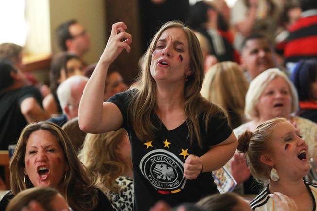 Germany fan Bianca Lutchen reacts after a missed shot while watching their World Cup final game against Argentina at the Hofbrauhaus Sunday, July 13, 2014.