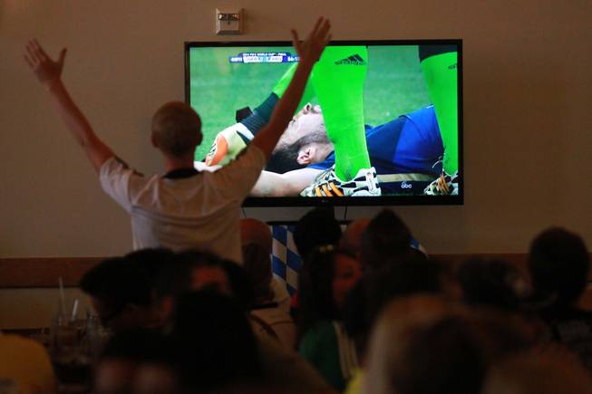 A Germany fans reacts to a play while watching their World Cup final game against Argentina at the Hofbrauhaus Sunday, July 13, 2014.