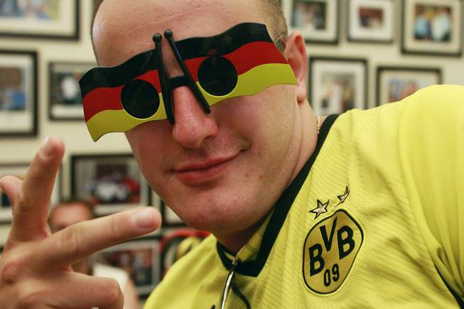 Germany fan Ruben Ovakimian models his novelty glasses while watching their World Cup final game against Argentina at the Hofbrauhaus Sunday, July 13, 2014.