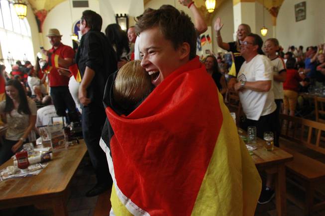 Germany fans celebrate at the Hofbrauhaus as time expires in their World Cup final game against Argentina at  Sunday, July 13, 2014.