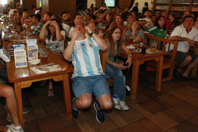 Argentina fan Marco Barnett reacts to a missed shot while watching their World Cup final game against Germany at the Hofbrauhaus Sunday, July 13, 2014.