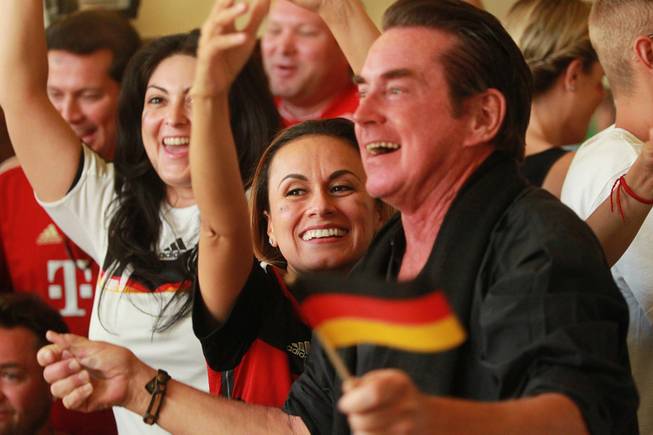 Germany fans celebrate at the Hofbrauhaus as time expires in their World Cup final game against Argentina at  Sunday, July 13, 2014.