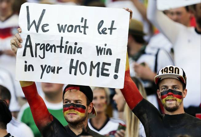 German supporters hold up a banner before the World Cup final soccer match between Germany and Argentina at the Maracana Stadium in Rio de Janeiro, Brazil, Sunday, July 13, 2014.