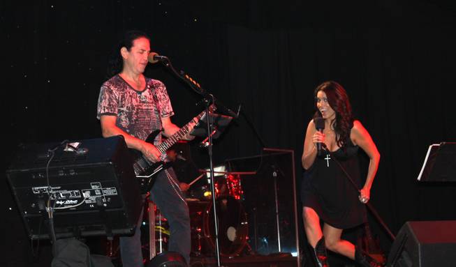 Amanda Avila performs with Venus Rising on Saturday, July 12, 2014, in the Lounge at Excalibur.