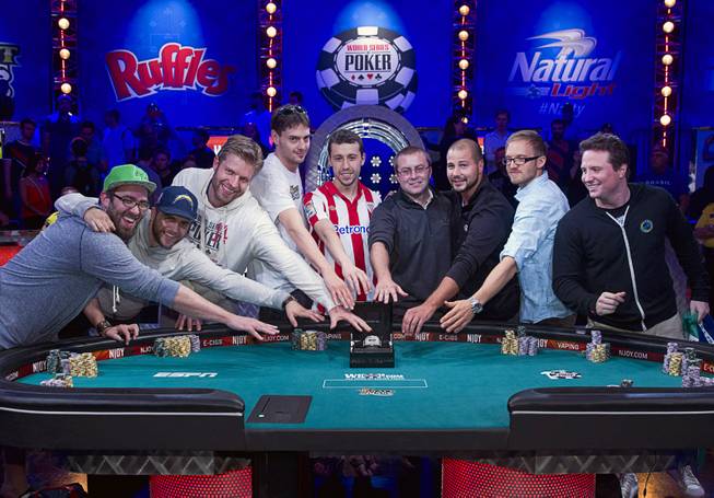 Members of the November Nine reach for the championship bracelet after making it to the Final Table during the World Series of Poker $10,000 Buy-In No-Limit Texas Hold 'em Main Event at the Rio on Tuesday, July 15, 2014. Players from left: Billy Pappaconstantinou of Lowell, Mass.; Felix Stephensen of Norway; Jorryt van Hoof of the Netherlands; Mark Newhouse of Los Angeles, who now lives in Las Vegas; Andoni Larrabe of Spain; William Tonking of Flemington, N.J.; Daniel Sindelar, originally from Columbus, Neb., now living in Las Vegas; Martin Jacobson of Sweden; and Bruno Politano of Brazil. 