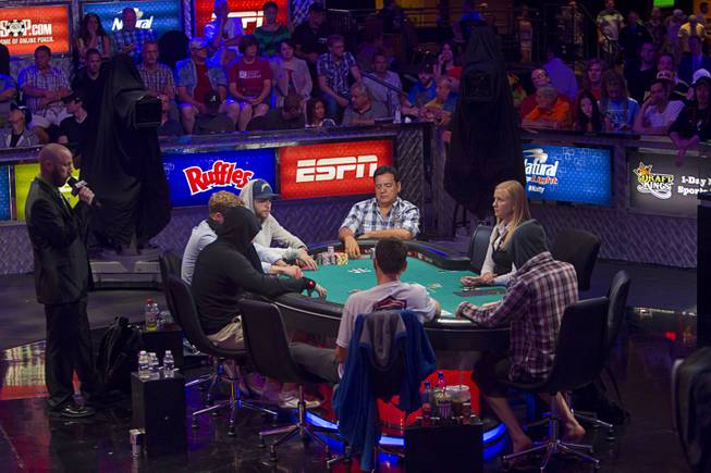 Poker players compete during the World Series of Poker $10,000 buy-in No-limit Texas Hold 'em main event at the Rio Monday, July 14, 2014.