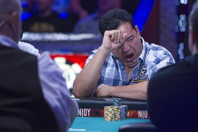 Luis Velador of Corona, Calif. yawns during the World Series of Poker $10,000 buy-in No-limit Texas Hold 'em main event at the Rio, July 14, 2014. Velador finished in 10th place.