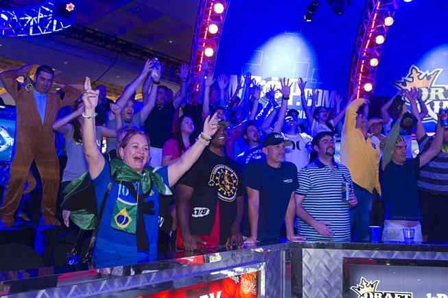 Supporters of Bruno Politano of Brazil celebrate after Politano made it to the final table during the World Series of Poker $10,000 buy-in No-limit Texas Hold 'em main event at the Rio, July 14, 2014. Politano is the first Brazilian to make the WSOP Main Event final table.