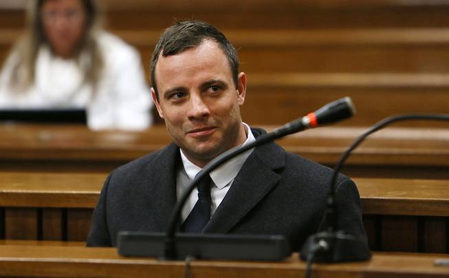 In this Tuesday, July 8, 2014, file photo Oscar Pistorius sits in the dock in Pretoria, South Africa, at his murder trial for the shooting death of his girlfriend Reeva Steenkamp on St. Valentine's Day, 2013.
